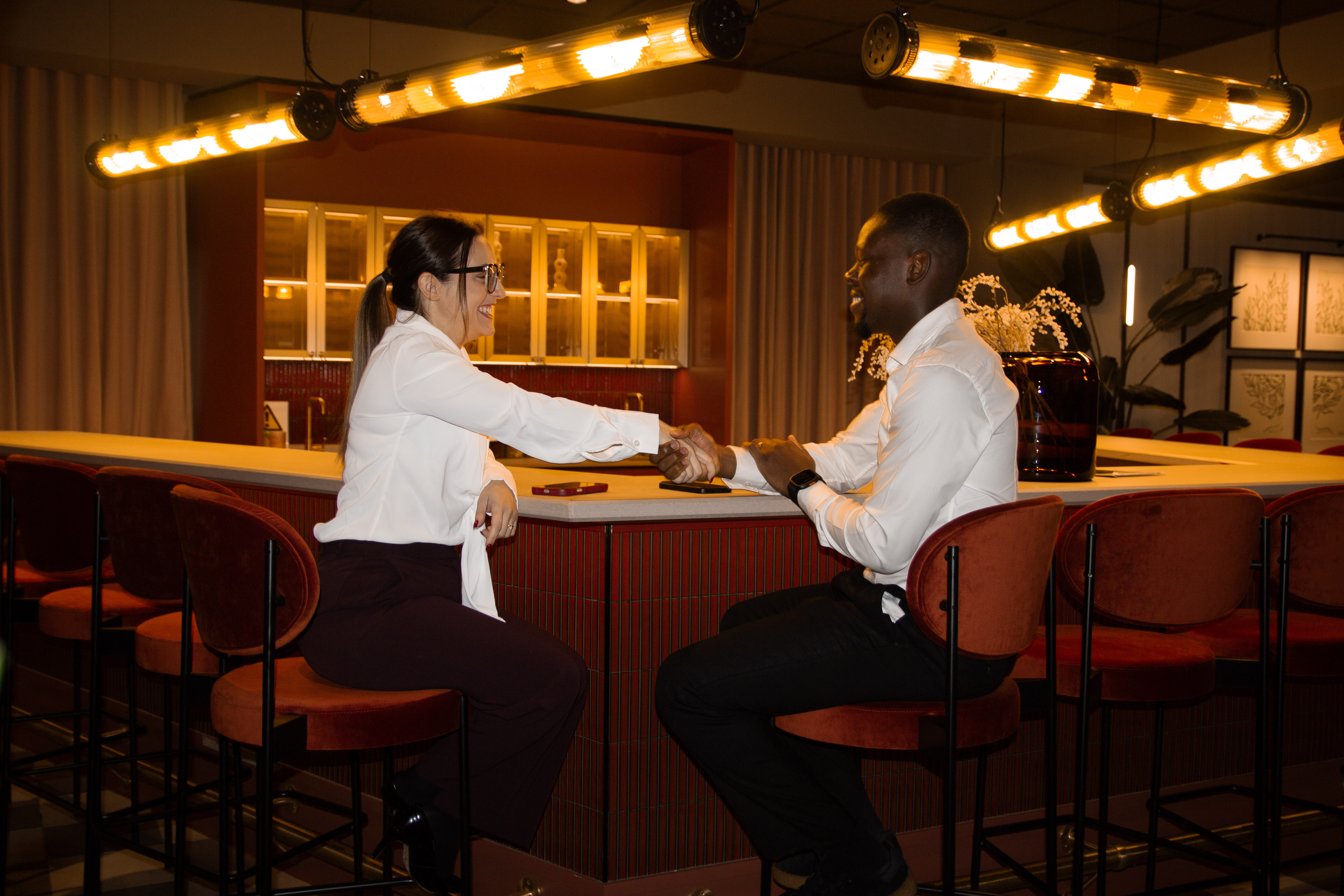 Curated connections couple shaking hands